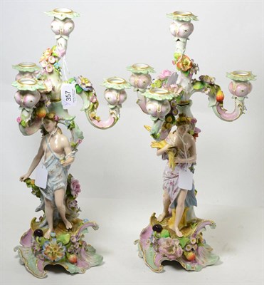 Lot 357 - A pair of 19th century German porcelain candelabra