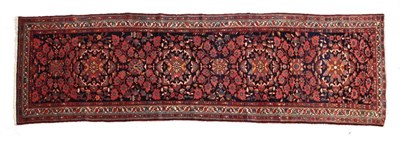 Lot 693 - Malayir Runner West Iran, circa 1920 The indigo field of floral vines around a column of flowerhead