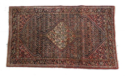 Lot 694 - Jozan Rug West Iran, circa 1925 The indigo Herati field centred by a lemon medallion framed by...