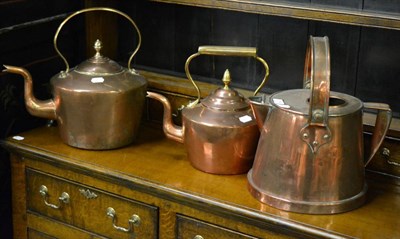 Lot 376 - Two large copper kettles and a jug with carrying handle