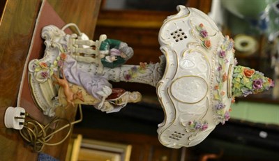 Lot 377 - A Continental flower encrusted figural lamp and shade