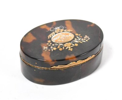 Lot 398 - A 19th century oval tortoiseshell hinged box with pique inlay and a miniature set to underside...