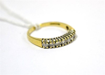 Lot 420 - An 18ct gold diamond seven stone ring stamped