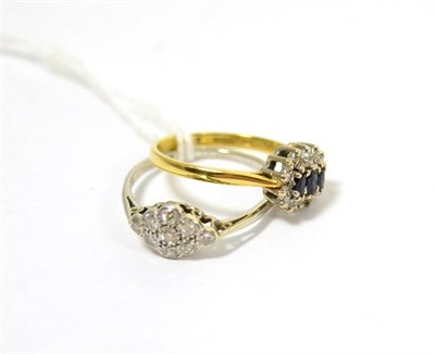 Lot 432 - An 18ct gold sapphire and diamond triple cluster ring and a diamond cluster ring on a white...