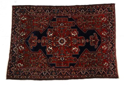 Lot 703 - Bakhtiyari Rug of unusual size West Iran, circa 1930 The indigo crennellated field centred by a...