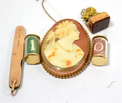 Lot 442 - A cameo brooch, two charms, a swivel fob surmounted with a lion and a 9ct gold cased penknife