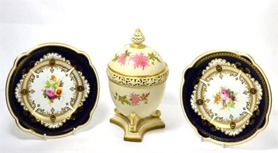 Lot 455 - A Royal Worcester blush ivory pot pourri vase and cover, with inner cover on a triform base and two