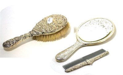 Lot 462 - A silver hand mirror, brush and comb