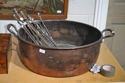 Lot 1000 - A quantity of assorted period steel fire irons and a large copper twin handled fish kettle