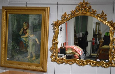 Lot 1007 - A large modern decorative gilt framed wall mirror and a large gilt framed print of two young...