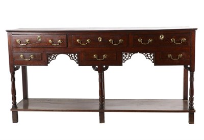 Lot 713 - A George III Oak Open Dresser, mid 18th century , with an arrangement of six drawers above a...