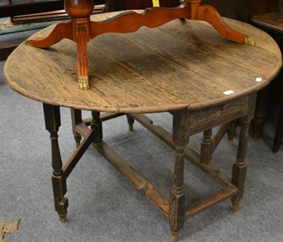 Lot 1035 - A late 18th century oak gateleg dining table