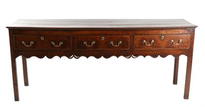 Lot 718 - A George III Oak Dresser, 3rd quarter 18th century, with three frieze drawers above a wavy...