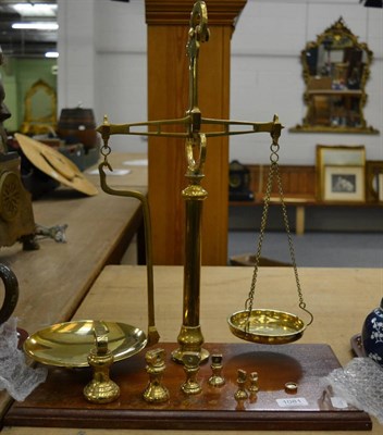 Lot 1081 - A set of 19th century brass scales and weights (7)