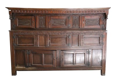 Lot 721 - A Massive 17th Century Joined Oak Press Cupboard, initialled TMD and dated 1650, the moulded canopy