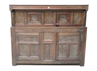 Lot 722 - A Yorkshire 17th Century Joined Oak Press Cupboard, the moulded frieze above two cupboard doors...