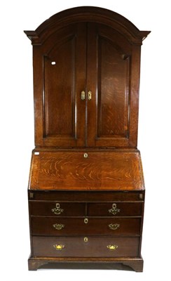 Lot 723 - A George III Oak Bureau Bookcase, 3rd quarter 18th century, the moulded architectural pediment...