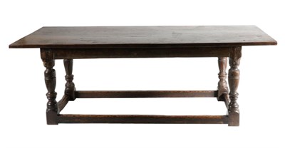 Lot 726 - A Late 17th Century Oak Refectory Style Dining Table, of plank top construction above a moulded...