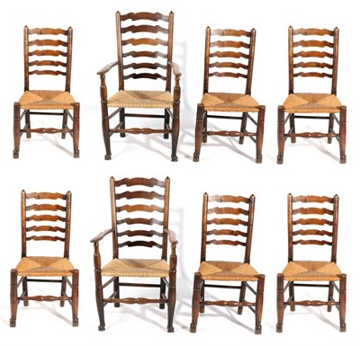 Lot 727 - A Matched Set of Eight George III Ash and Elm Rush-Seated Ladder-Back Chairs, early 19th...