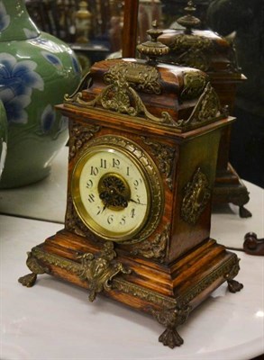 Lot 1198 - An oak and brass mantle clock