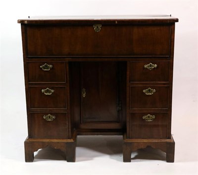 Lot 733 - A George II Walnut and Rosewood Crossbanded Kneehole Desk, 2nd quarter 18th century, the hinged lid