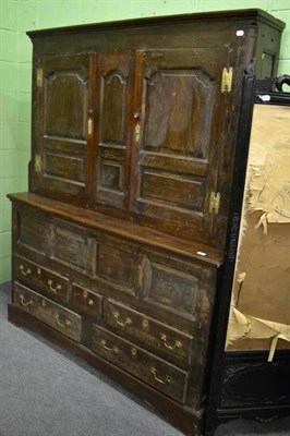 Lot 1209 - A late 18th century enclosed oak dresser