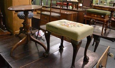 Lot 1214 - A Victorian revolving piano stool carved with fish, a tripod table and a mahogany stool on claw and