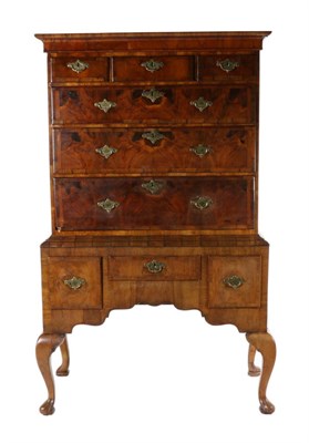 Lot 734 - A George II Style Walnut and Featherbanded Chest on Stand, the moulded cornice above three...