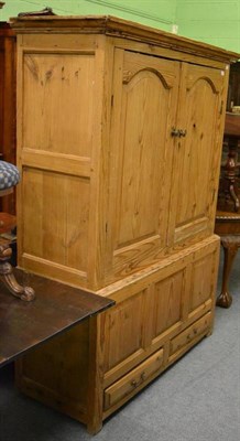 Lot 1220 - A 19th century pitch pine livery cupboard