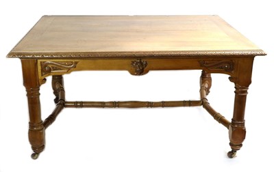 Lot 735 - A Victorian Walnut Library Table, late 19th century, the carved border above a frieze centred...