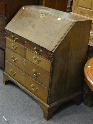 Lot 1228 - A Georgian oak bureau