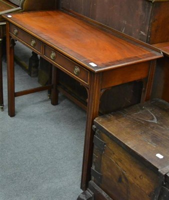 Lot 1235 - A reproduction two drawer mahogany side table