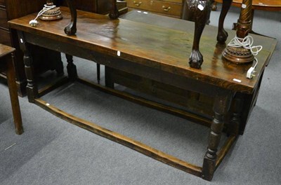 Lot 1240 - 18th century and later oak refectory table on stretcher base