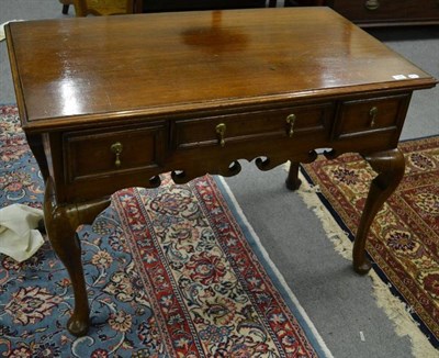 Lot 1245 - A late Victorian style oak lowboy with three drawers