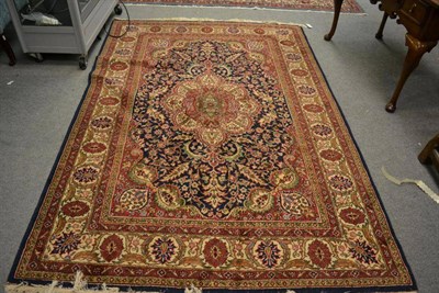 Lot 1248 - Oriental design rug, the indigo field centred by an indigo medallion framed by spandrels and...