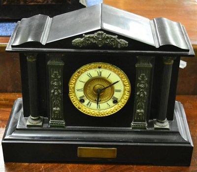 Lot 1253 - A black slate mantel clock