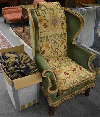 Lot 1265 - A Carolean style wing armchair on stretcher base with green velvet and machine woven upholstery