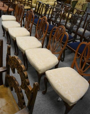 Lot 1268 - A set of six oak framed dining chairs with stylised carved back splats