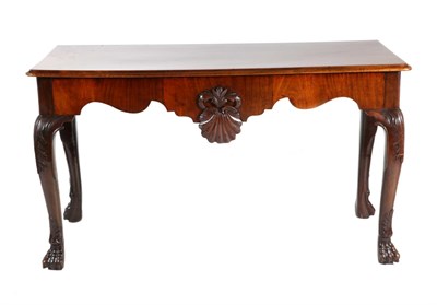 Lot 741 - A George III Mahogany Serving Table, late 18th century, the moulded top above a shaped apron...