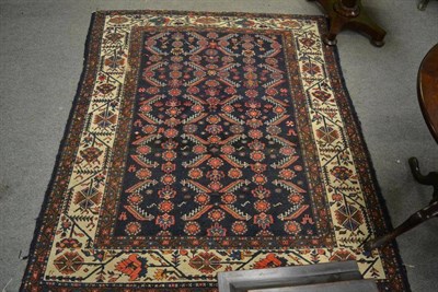 Lot 1287 - Malayir rug of unusual size, West Persia the deep indigo field with columns of serrated leaves...