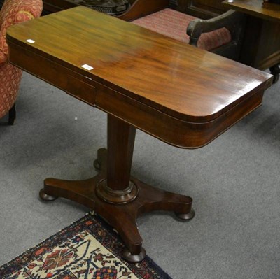 Lot 1288 - An early 19th century mahogany fold over games table