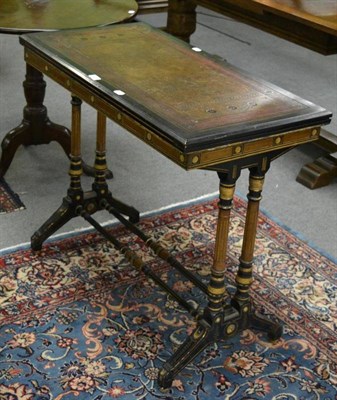 Lot 1290 - A Victorian mahogany and ebonised swivelling fold-over card table