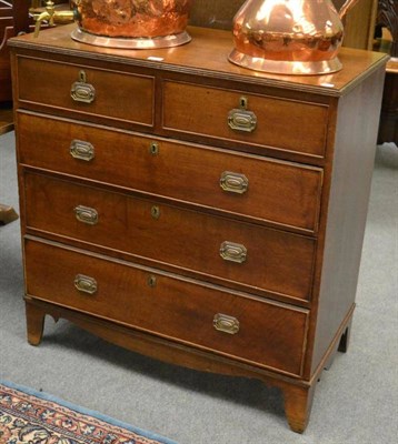 Lot 1291 - A Georgian four height oak chest of drawers