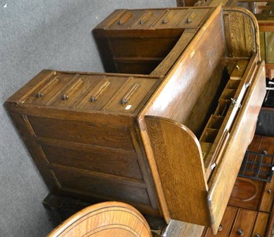 Lot 1300 - A 20th century oak roll top desk