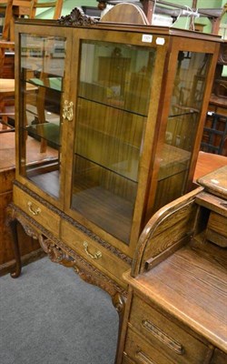 Lot 1301 - A 20th century walnut display cabinet