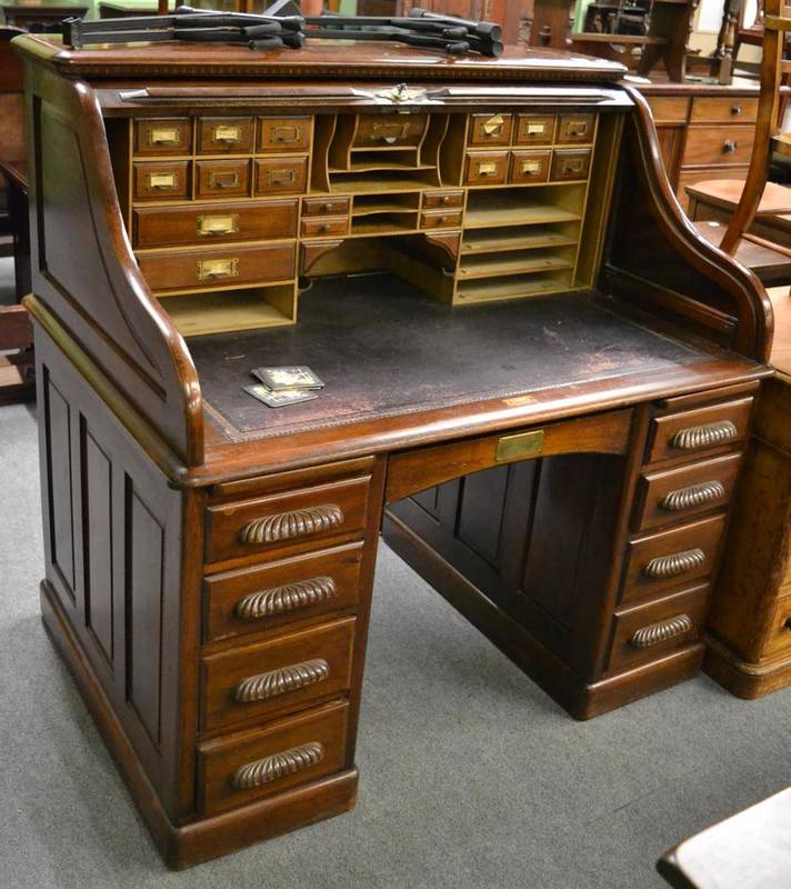 Lot 1304 - A Victorian mahogany roll top desk