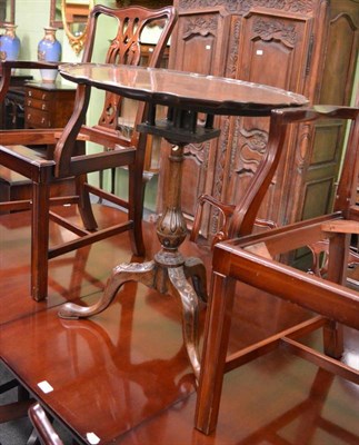 Lot 1310 - A carved mahogany tripod table