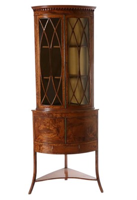 Lot 744 - A George III Satinwood and Ebony Strung Free-Standing Corner Cupboard, the arcaded cornice...