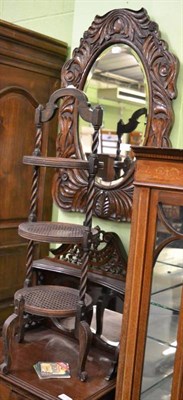 Lot 1319 - A carved oak mirror and cake stand