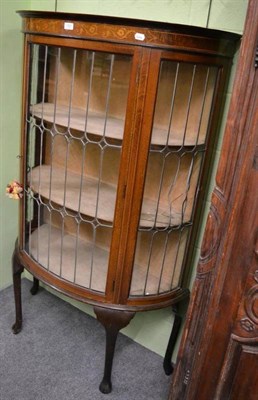 Lot 1321 - An Edwardian demi-lune display cabinet with leaded glass doors (damaged glass)